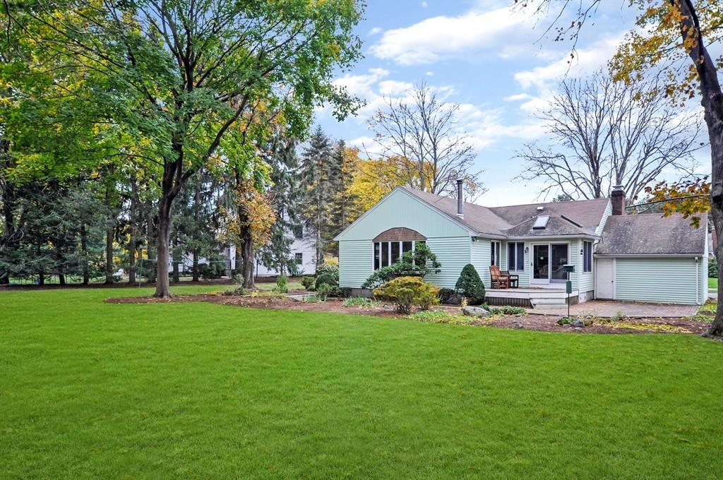 17 Cox Road Winchester, MA 01890 - Photo 2 of 19 a front view of a house with a yard and trees