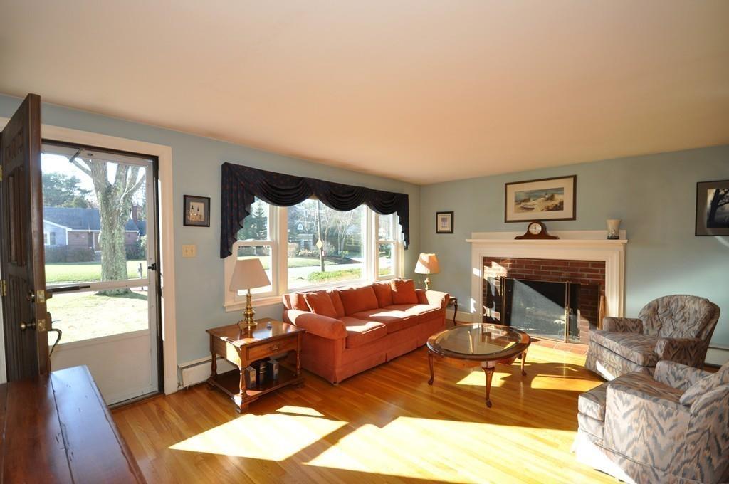 17 Cox Road Winchester, MA 01890 - Photo 4 of 19 a living room with furniture and a fireplace