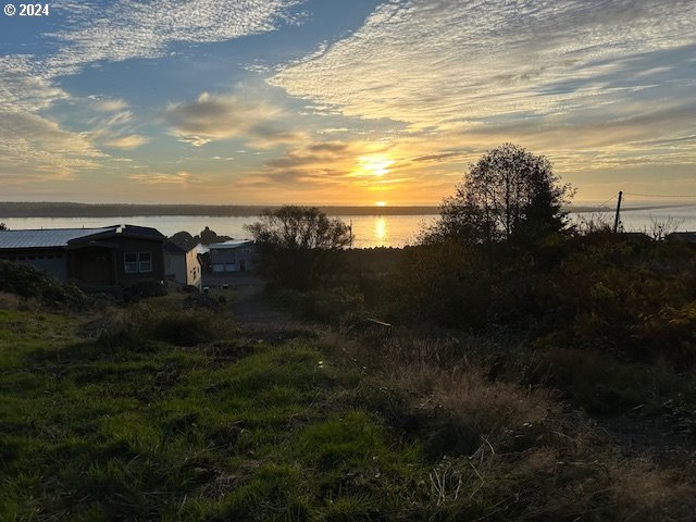 Grant Street Rockaway Beach, OR 97136 - Photo 7 of 10 a view of a lake with a yard