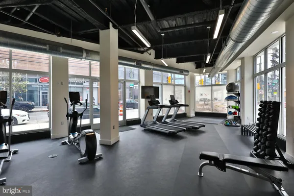 a bedroom with a large bed and a flat screen tv