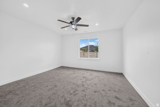 1002 West Temple Rim Lane Payson, UT 84651 - Photo 52 of 68 Spacious room featuring neutral carpeting, white walls, a single window, recessed lighting, and a ceiling fan