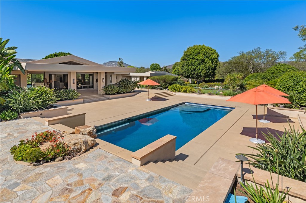 6533 Lago Lindo Rancho Santa Fe, CA 92067 - Photo 47 of 57 a view of a house with pool and chairs
