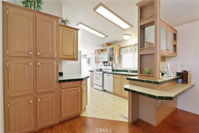 a kitchen with cabinets a sink and appliances