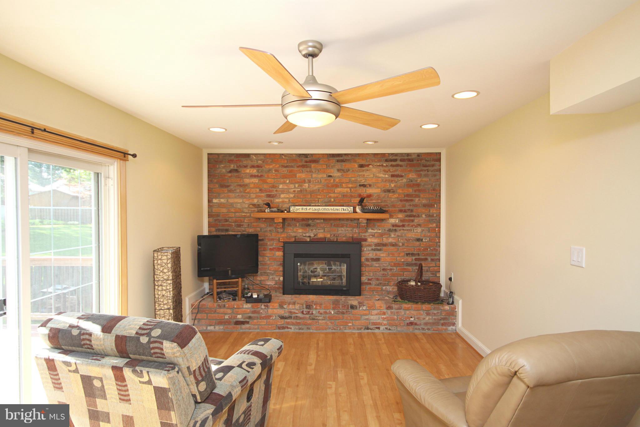 7707 Mahogany Road Severn, MD 21144 - Photo 10 of 30 a living room with furniture and a fireplace