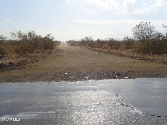 a view of a road with a beach
