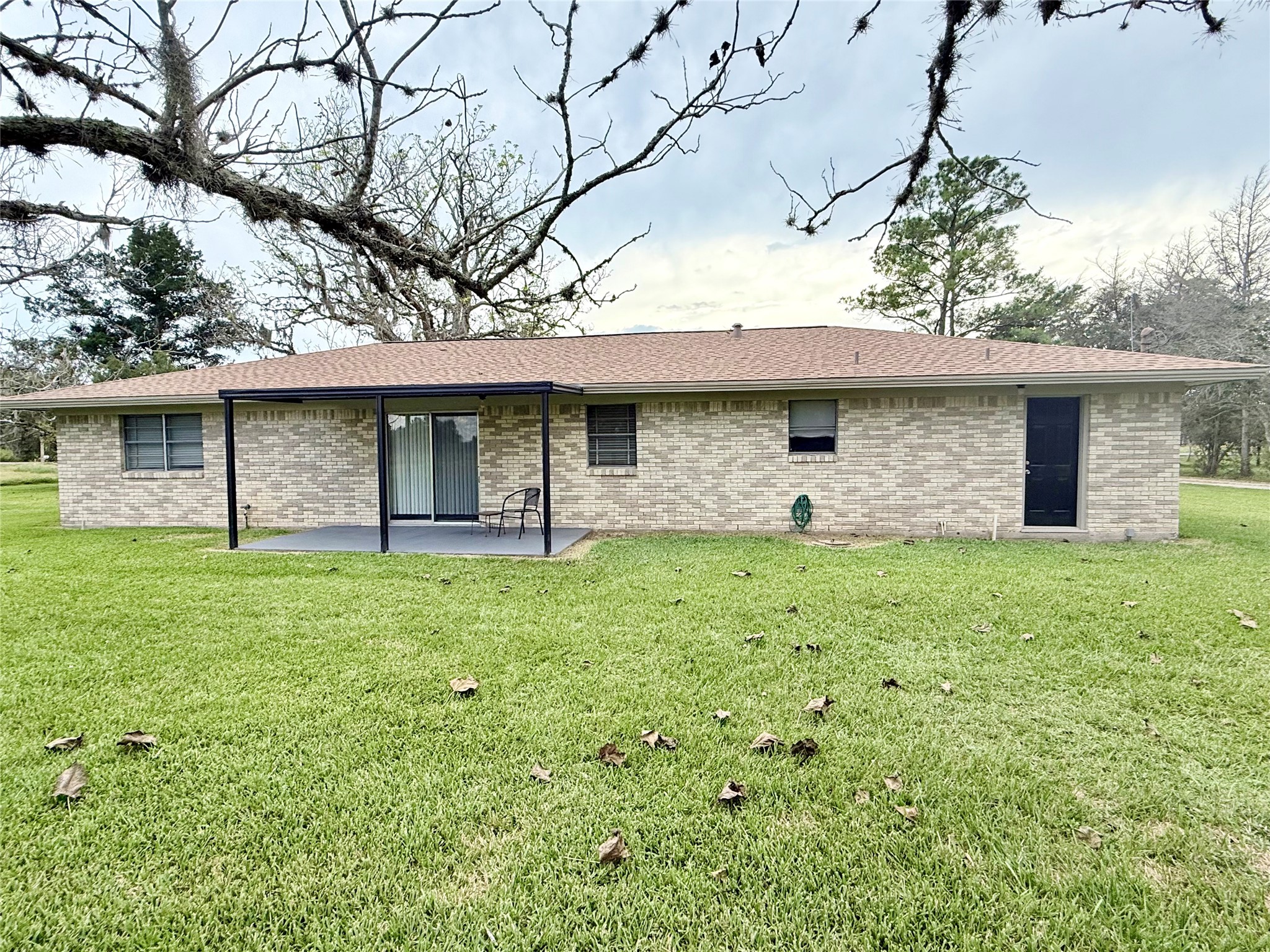 9639 FM 524 Road Sweeny, TX 77480 - Photo 5 of 12 a front view of a house with a garden