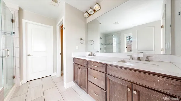 a bathroom with a tub and shower
