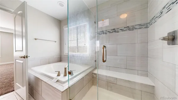 a white bath tub sitting next to a window