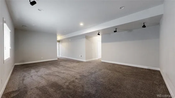 a view of an empty room and a window