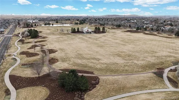 an aerial view of a house with outdoor space