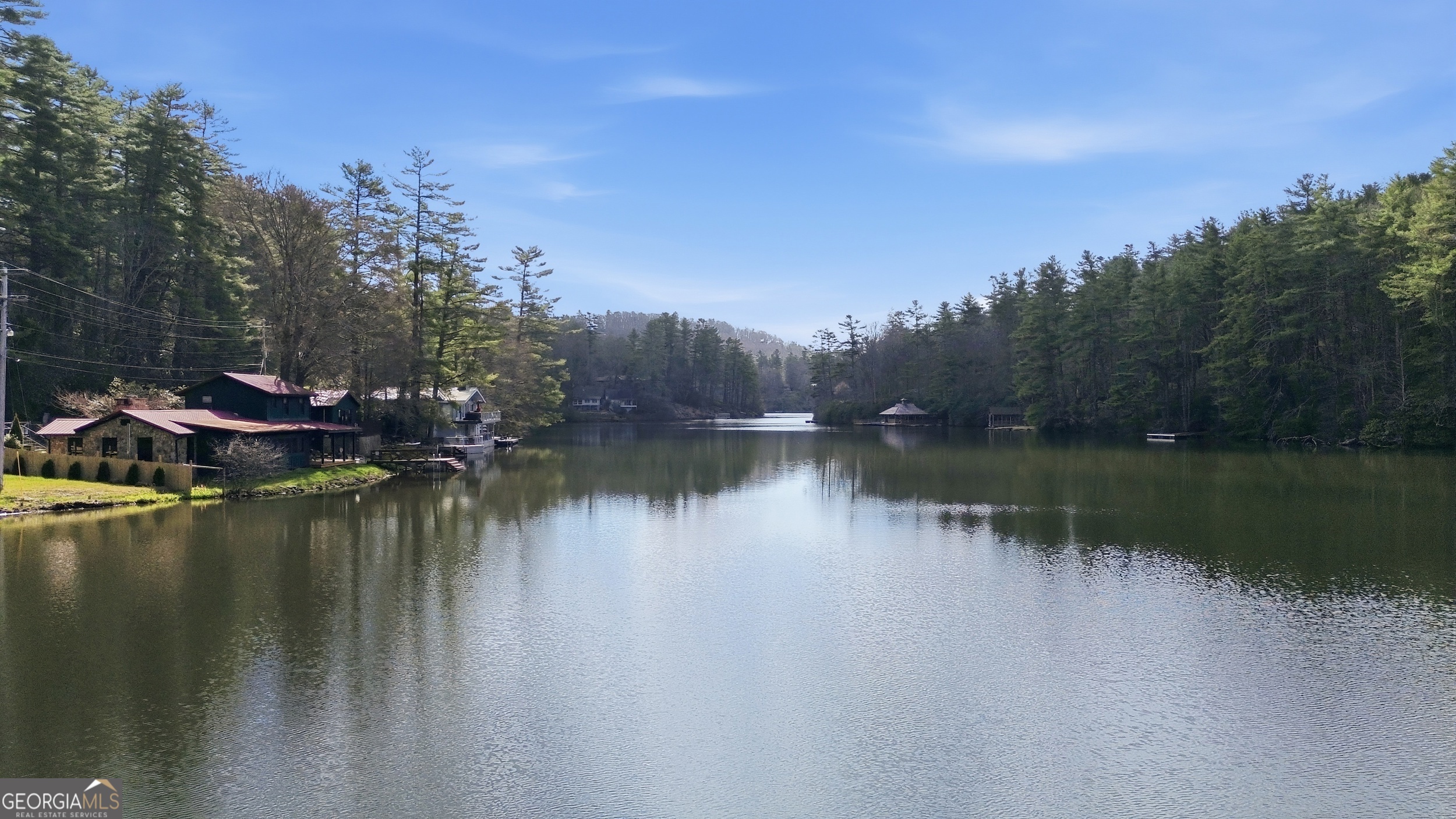 1921 Franklin Road Highlands, NC 28741 - Photo 52 of 72 a view of a lake with houses in the background