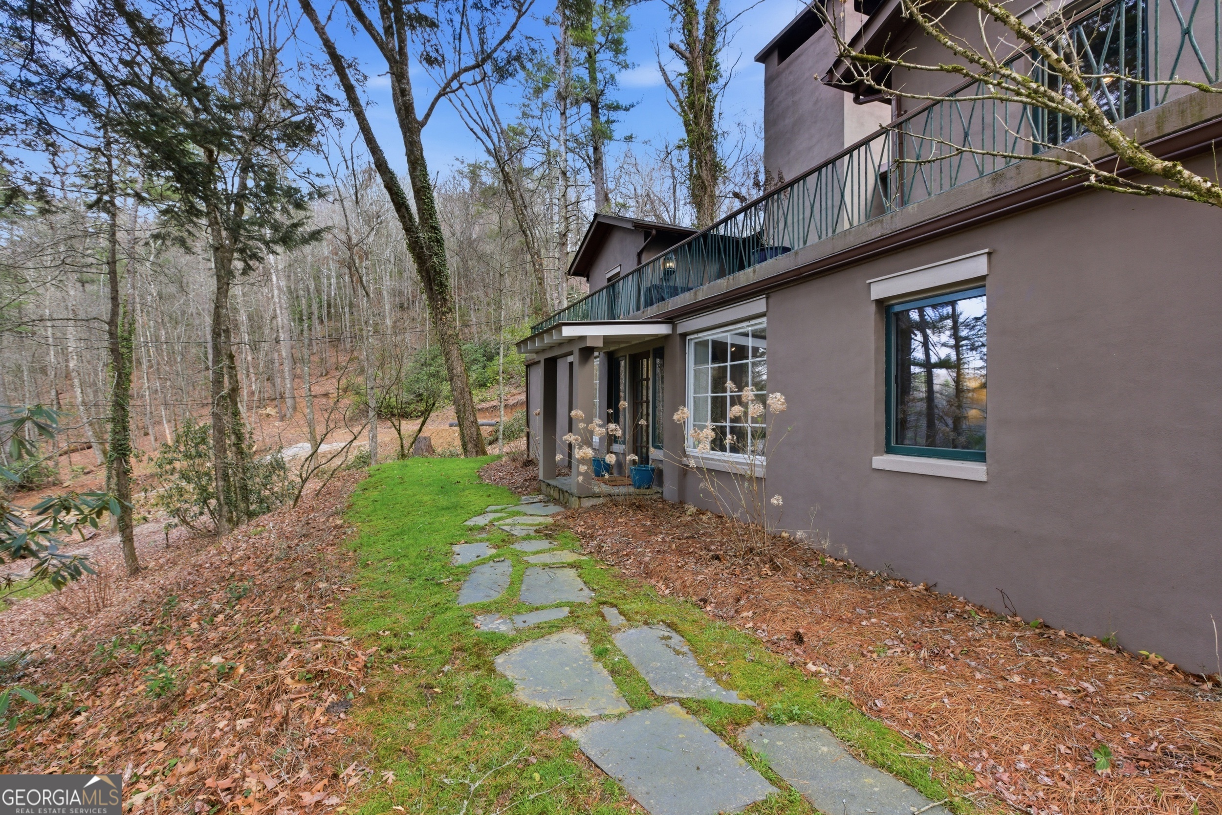 1921 Franklin Road Highlands, NC 28741 - Photo 64 of 72 a backyard of a house with table and chairs