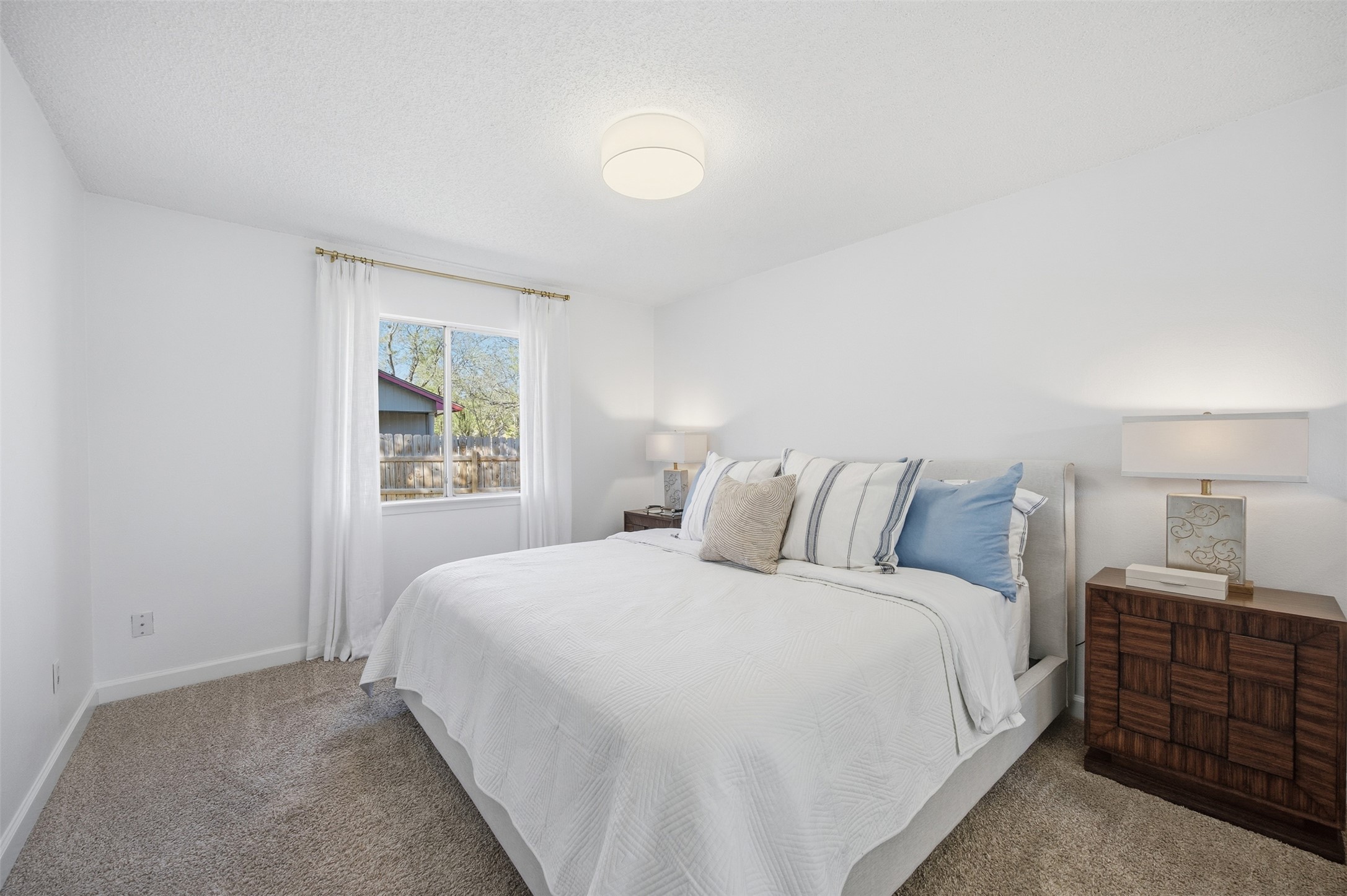 3200 Spaniel Drive Austin, TX 78759 - Photo 16 of 24 a bedroom with a bed and a window