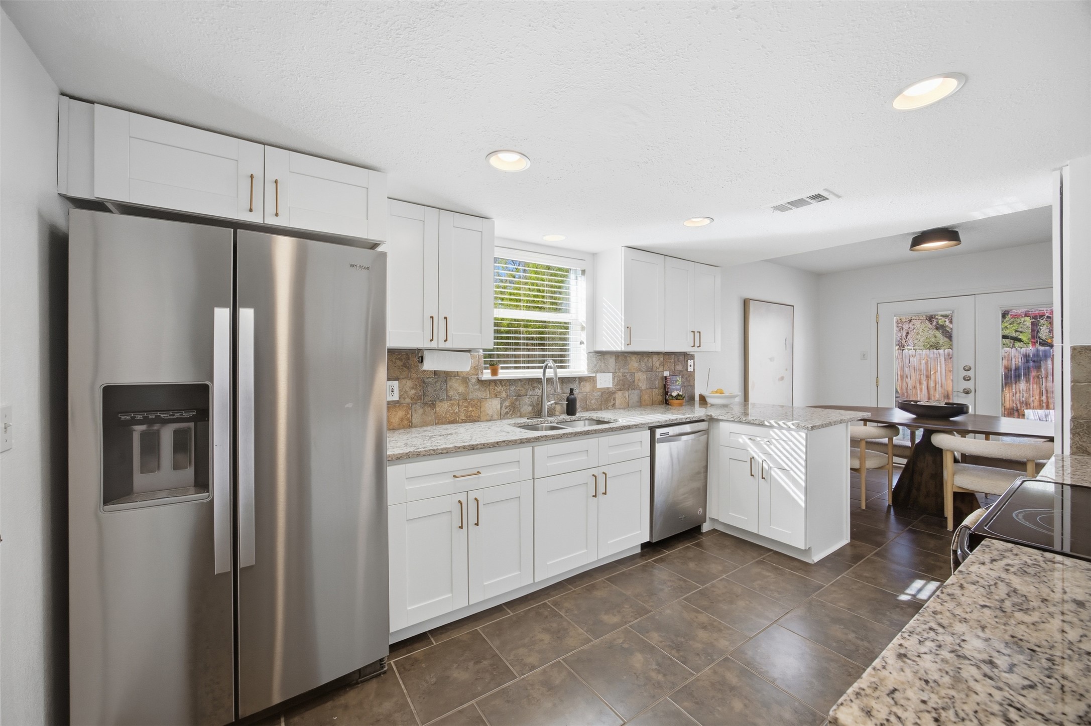 3200 Spaniel Drive Austin, TX 78759 - Photo 7 of 24 a kitchen with sink refrigerator and cabinets