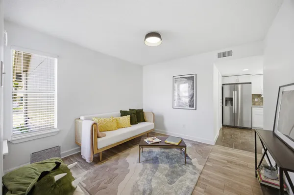a living room with furniture and a window