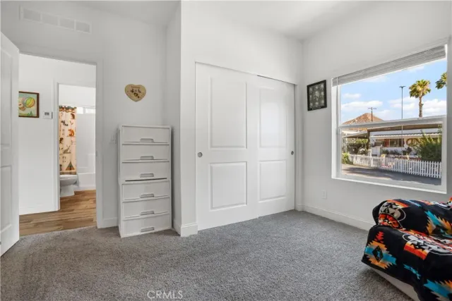 a view of a storage & utility room with a window