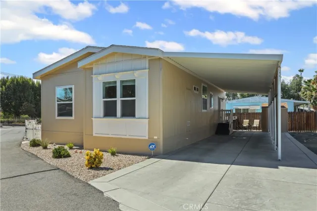 a living room with furniture and a ceiling fan