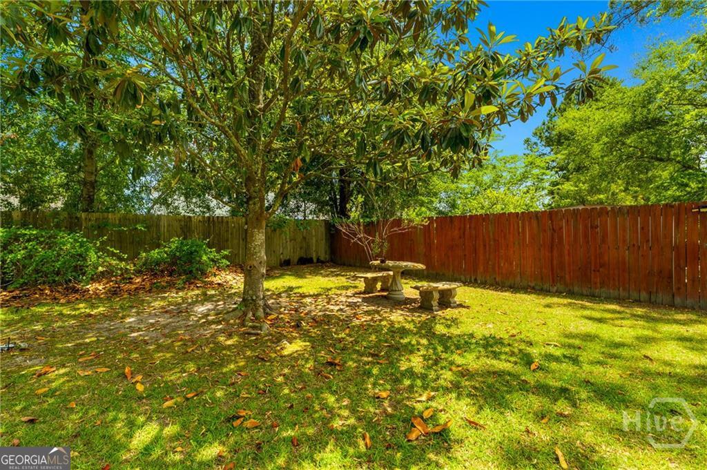 10 Fox Hound Court Pooler, GA 31322 - Photo 30 of 32 a view of garden with wooden fence