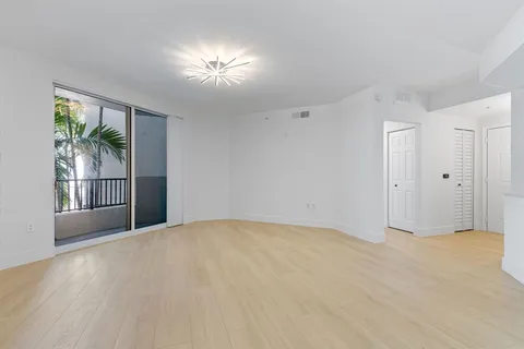 a view of an empty room with a window