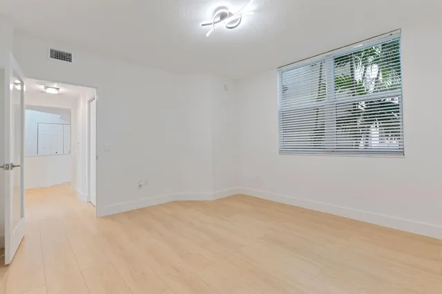 a view of an empty room with a window