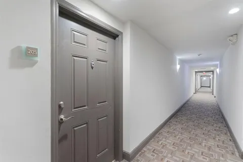 a view of a hallway with closet
