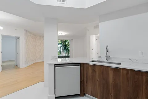 a kitchen with a sink and cabinets