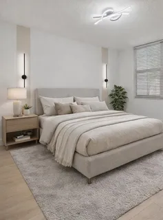 a kitchen with stainless steel appliances white cabinets and a refrigerator