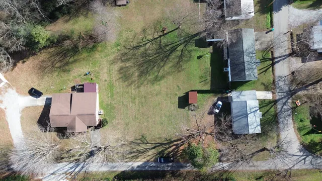 an aerial view of residential house with outdoor space