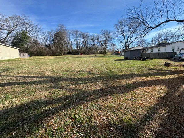 a view of a yard with an outdoor space