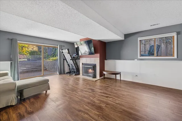 a view of a livingroom with furniture and a fireplace