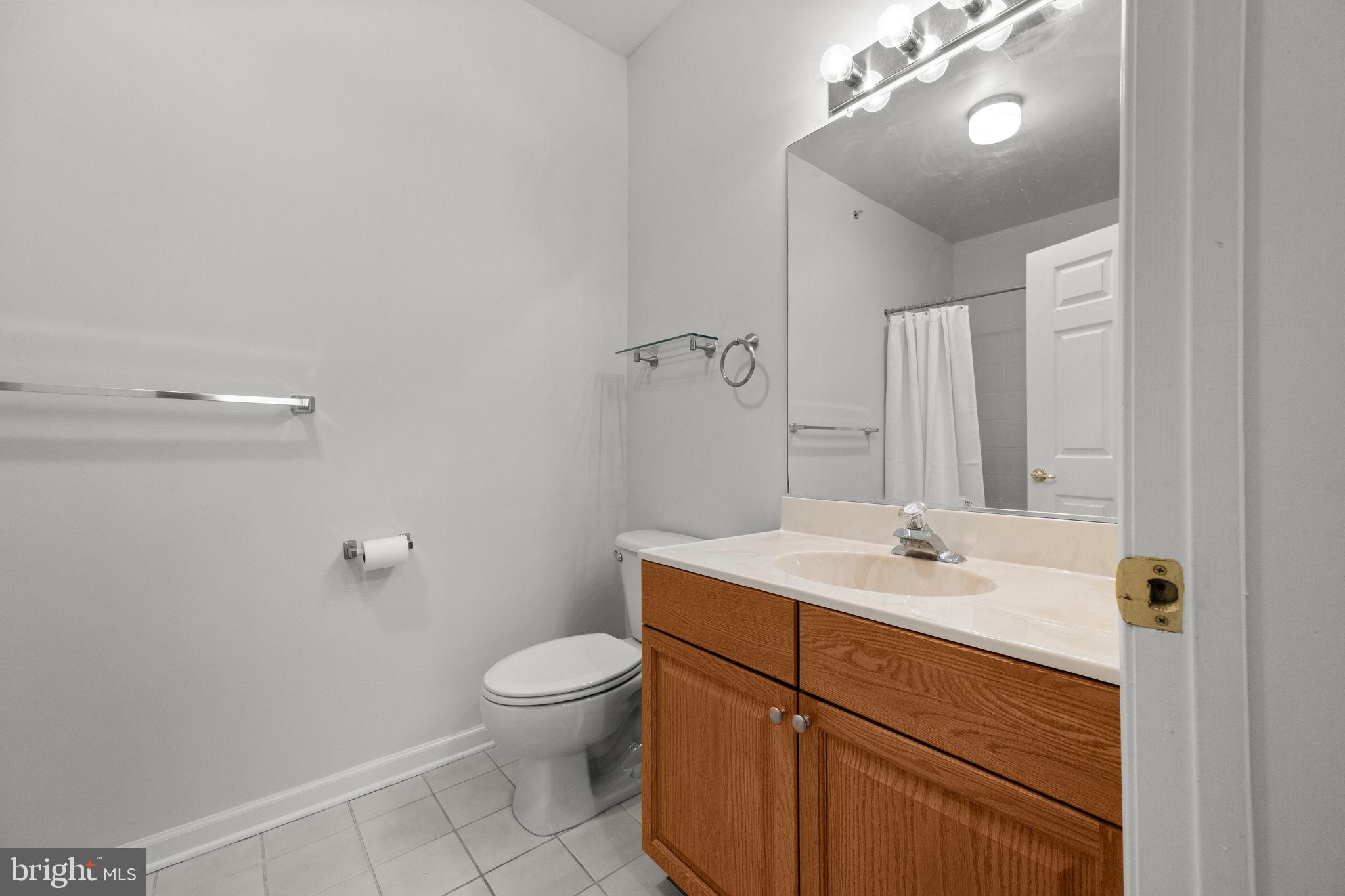 97 Kyle Way Ewing, NJ 08628 - Photo 17 of 33 a bathroom with a sink a toilet and a mirror
