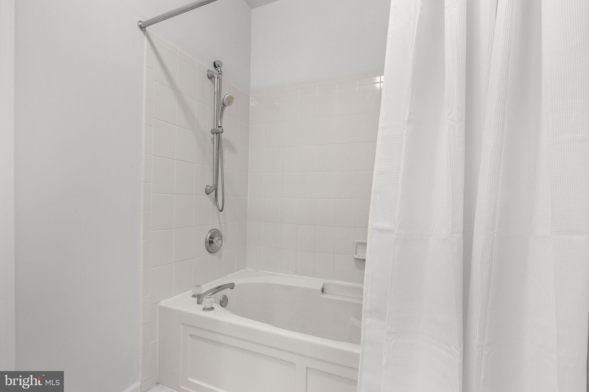 97 Kyle Way Ewing, NJ 08628 - Photo 18 of 33 a bathroom with a tub and a shower