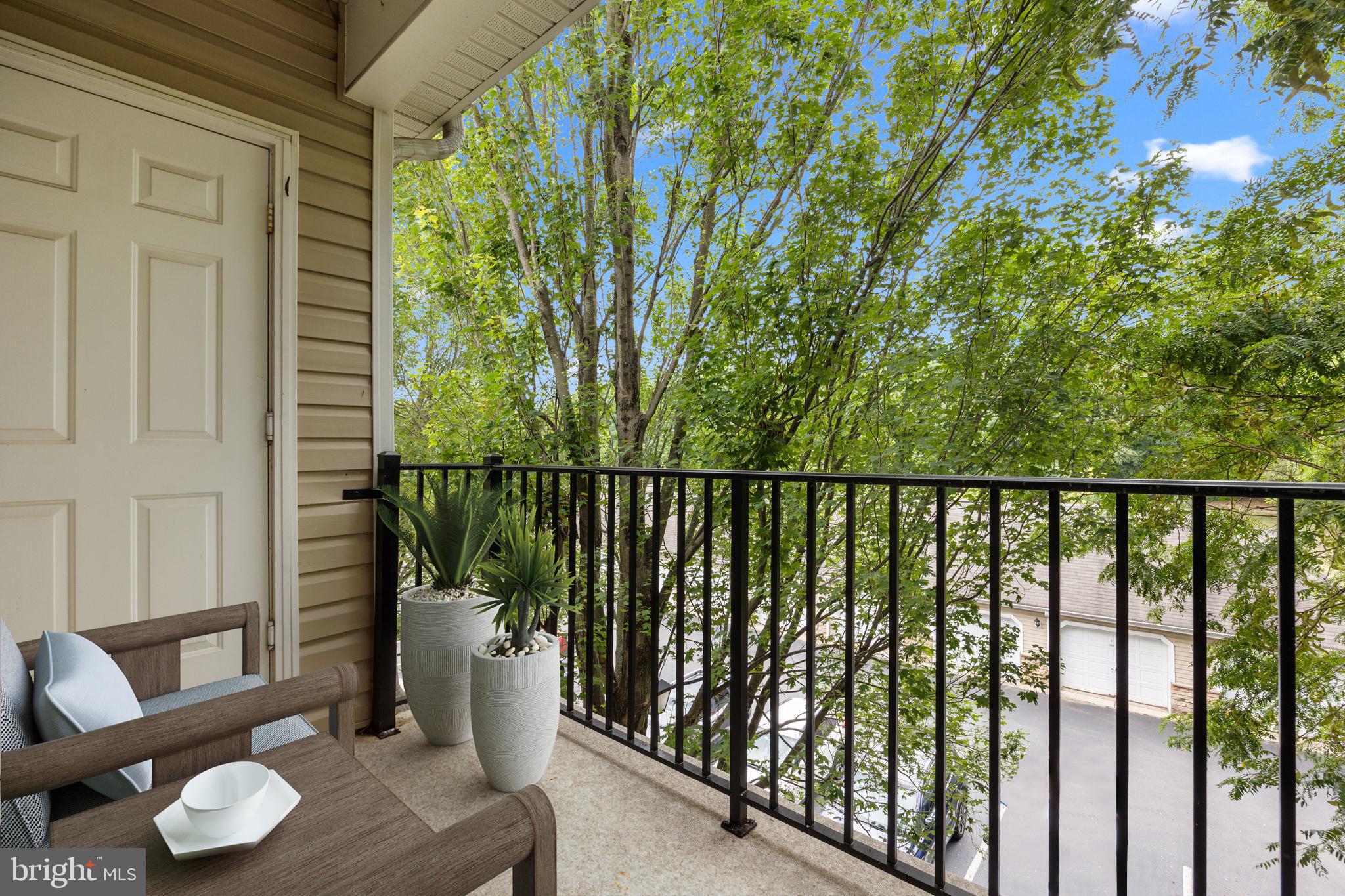 97 Kyle Way Ewing, NJ 08628 - Photo 23 of 33 a view of a balcony with chairs and wooden floor