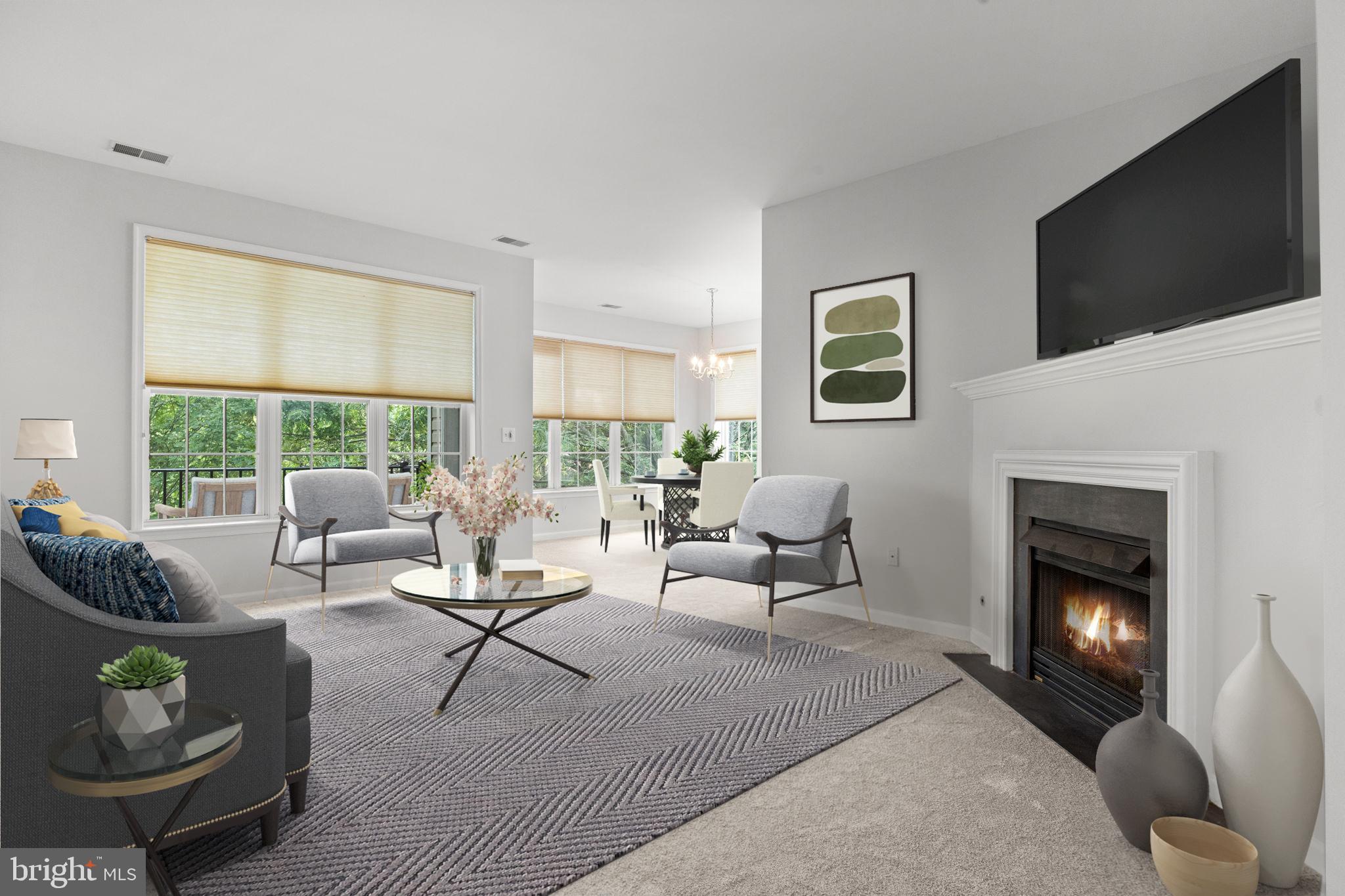 97 Kyle Way Ewing, NJ 08628 - Photo 6 of 33 a living room with furniture floor to ceiling window and a flat screen tv