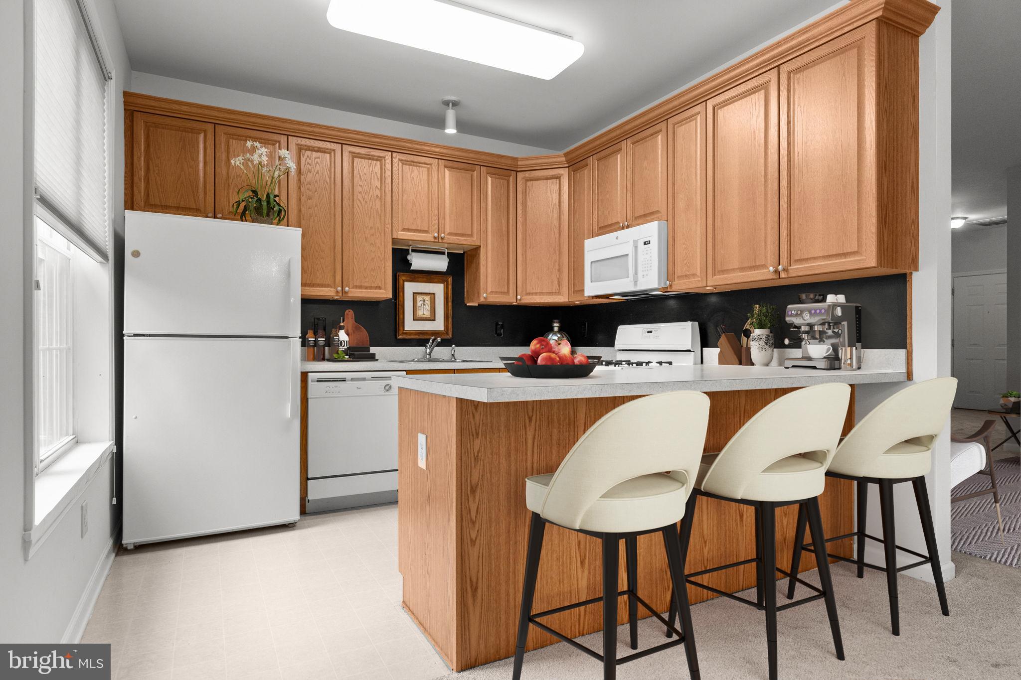 97 Kyle Way Ewing, NJ 08628 - Photo 9 of 33 a kitchen with stainless steel appliances a refrigerator sink stove microwave and cabinets