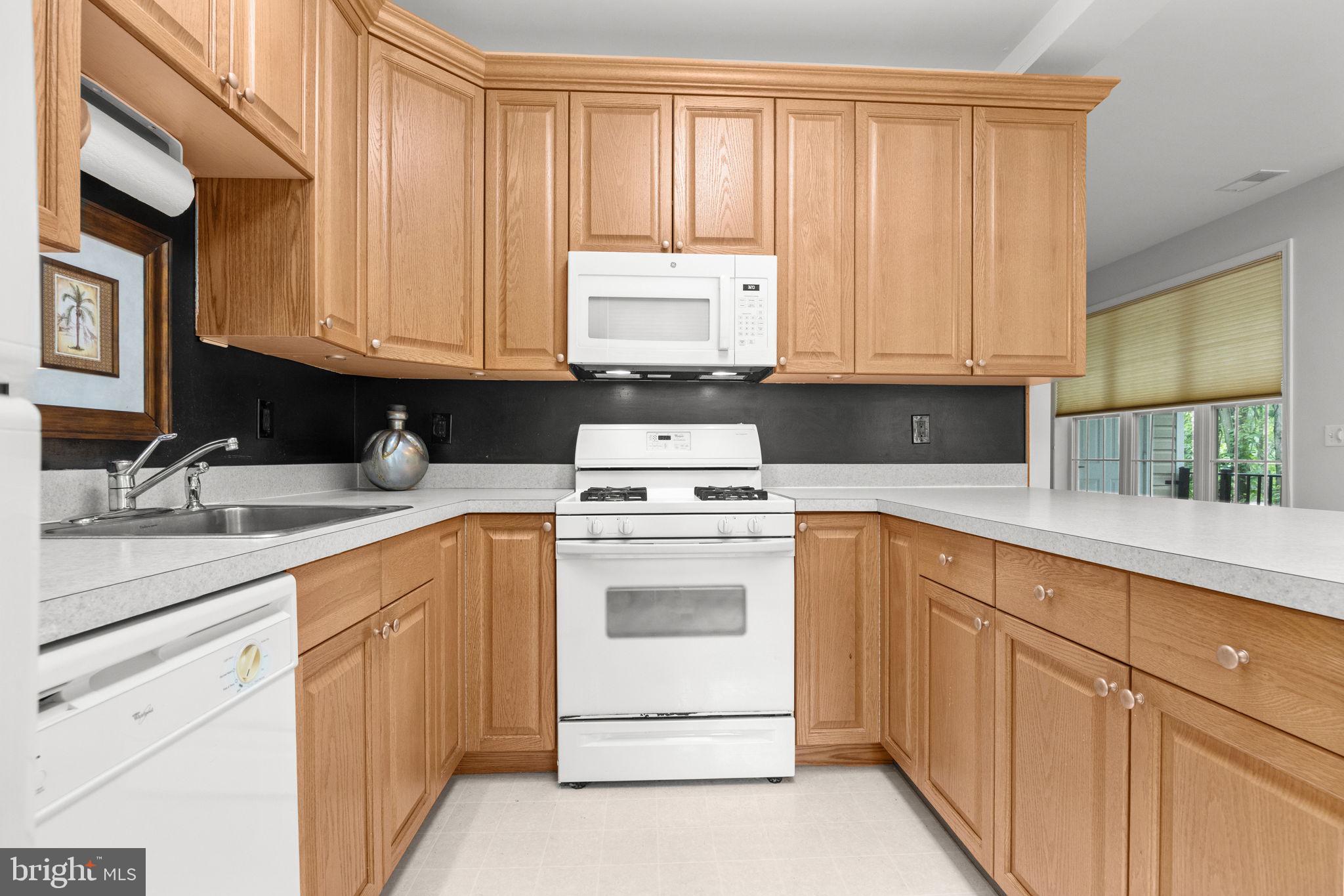 97 Kyle Way Ewing, NJ 08628 - Photo 10 of 33 a kitchen with granite countertop white cabinets and white appliances
