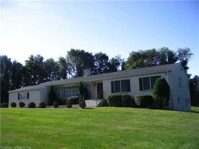 36 Spring Valley Road Woodbridge, CT 06525 - Photo 1 of 1 a front view of house with a garden and patio