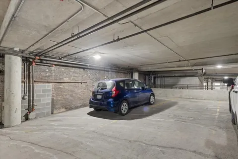 a picture of a room with a white wall and a painting