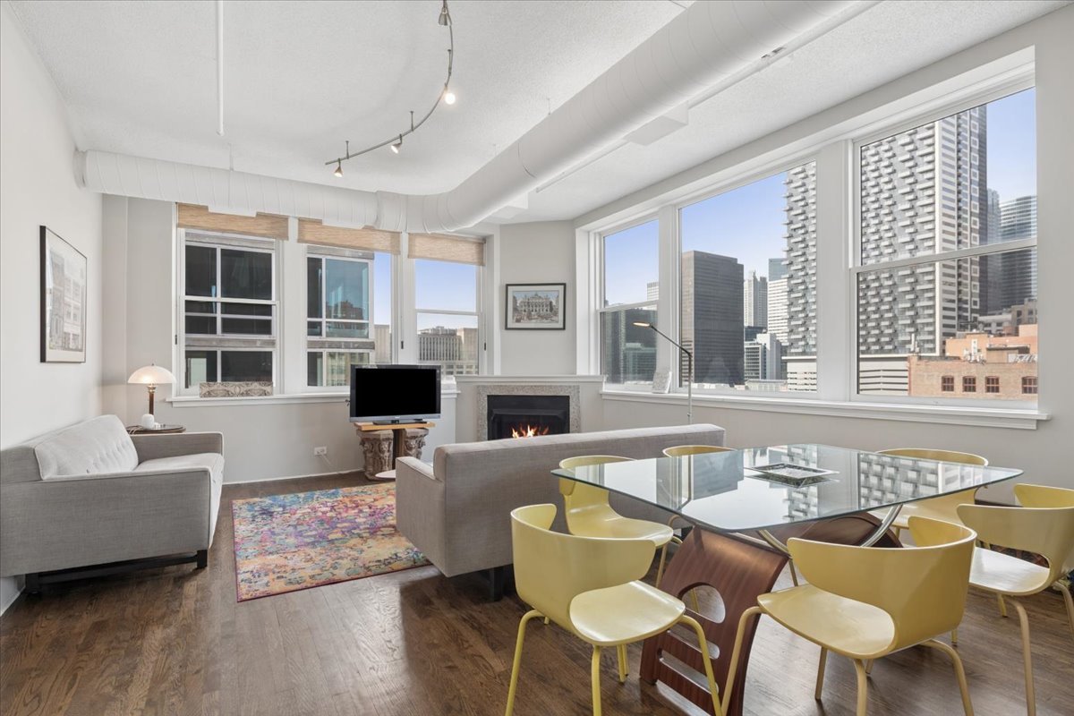 161 West Harrison Street, Unit 901 Chicago, IL 60605 - Photo 10 of 18 a living room with furniture and a large window