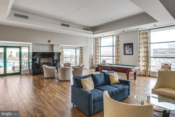 a living room with fireplace furniture and a window