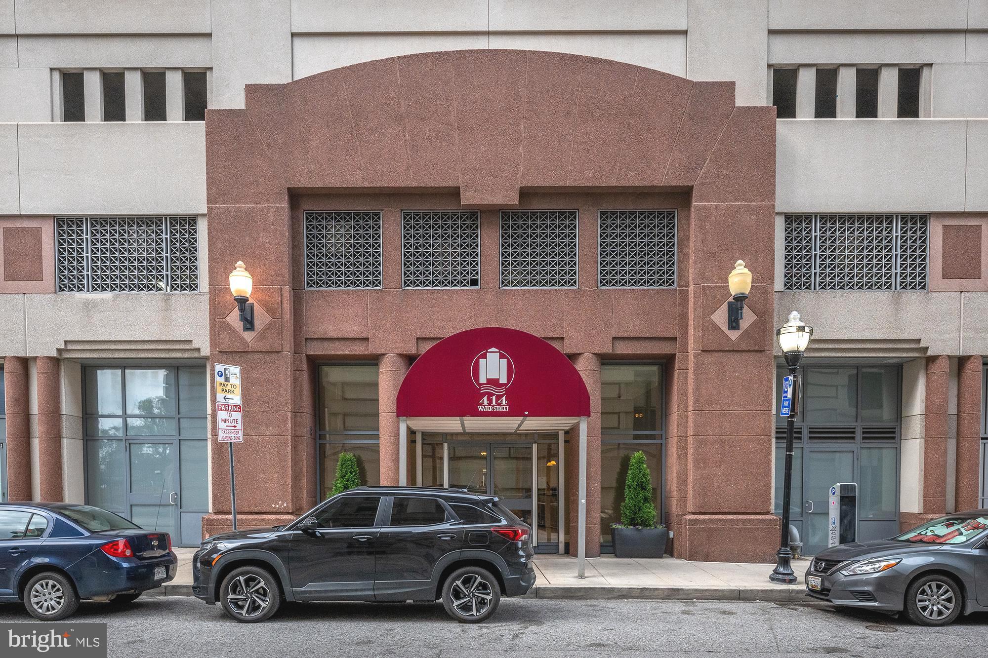 414 Water Street, Unit 2315 Baltimore, MD 21202 - Photo 3 of 31 Front desk person and a parking spot in the garage