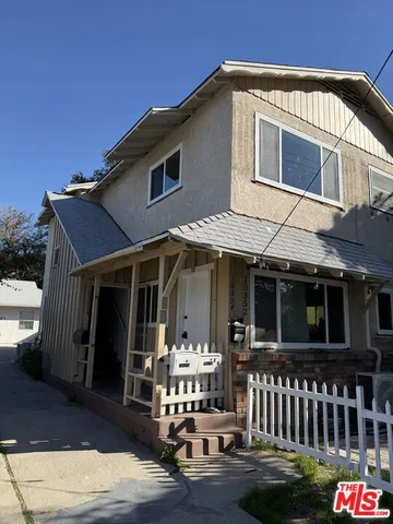 a front view of a house with a porch