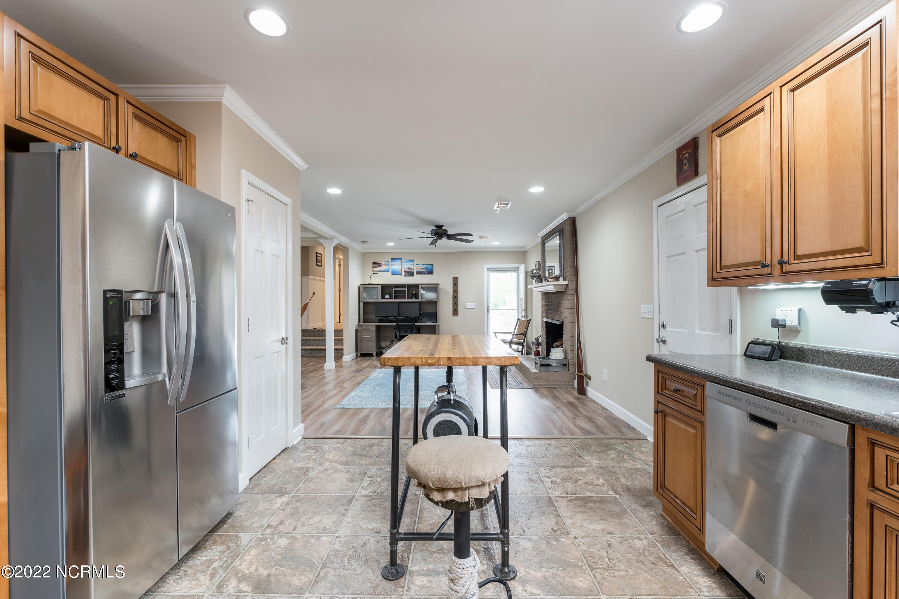5301 Peden Point Road Wilmington, NC 28409 - Photo 13 of 40 Kitchen looking toward Breakfest area, outside to pool