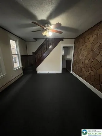 a view of a livingroom with a staircase
