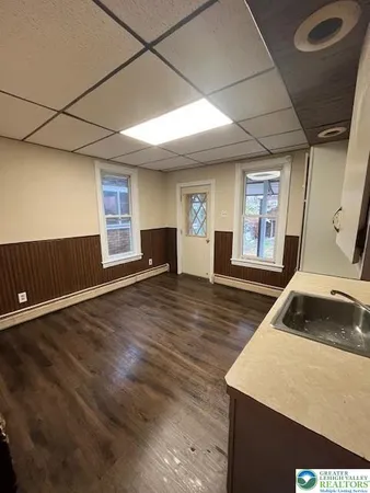 a view of a hallway with seating area