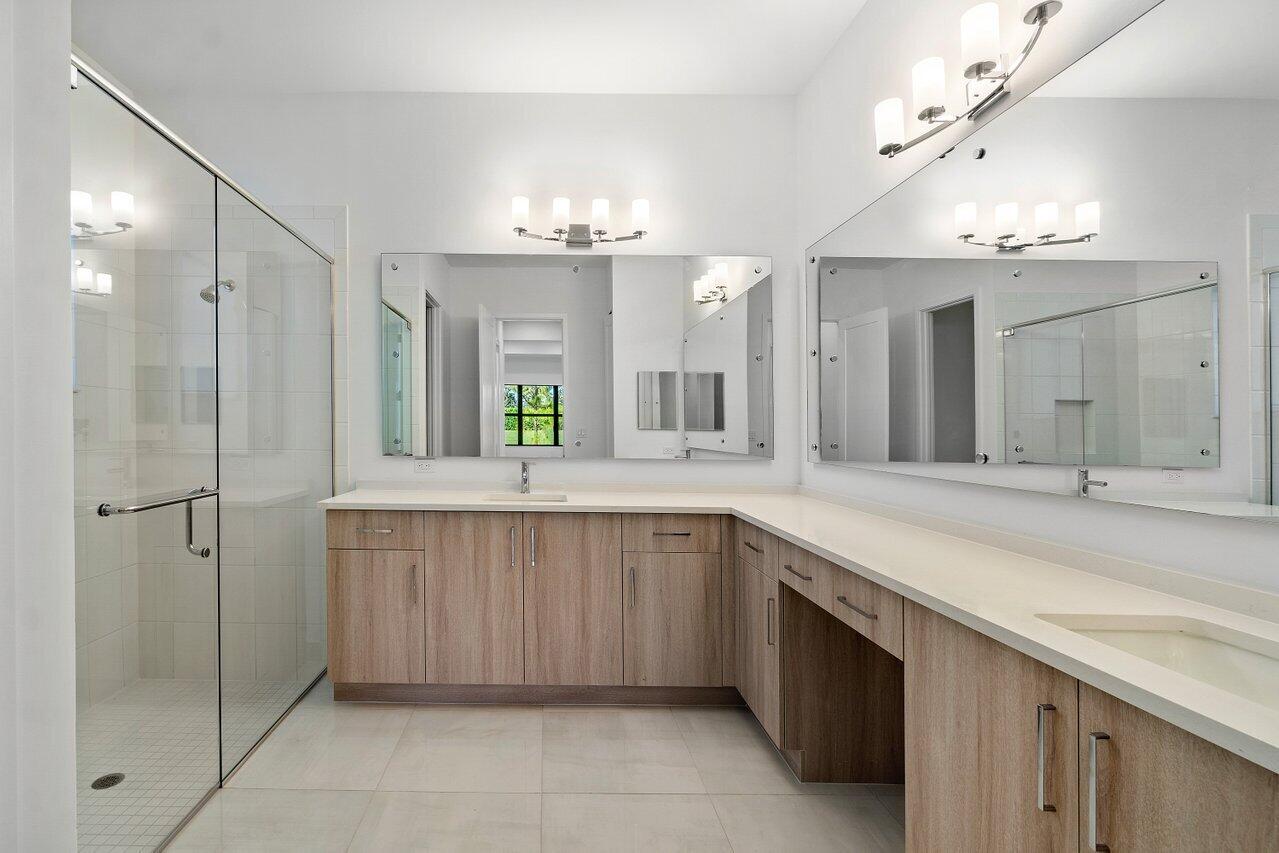 17291 Rainstream Road Boca Raton, FL 33496 - Photo 12 of 21 a spacious bathroom with a granite countertop sink mirror and a shower