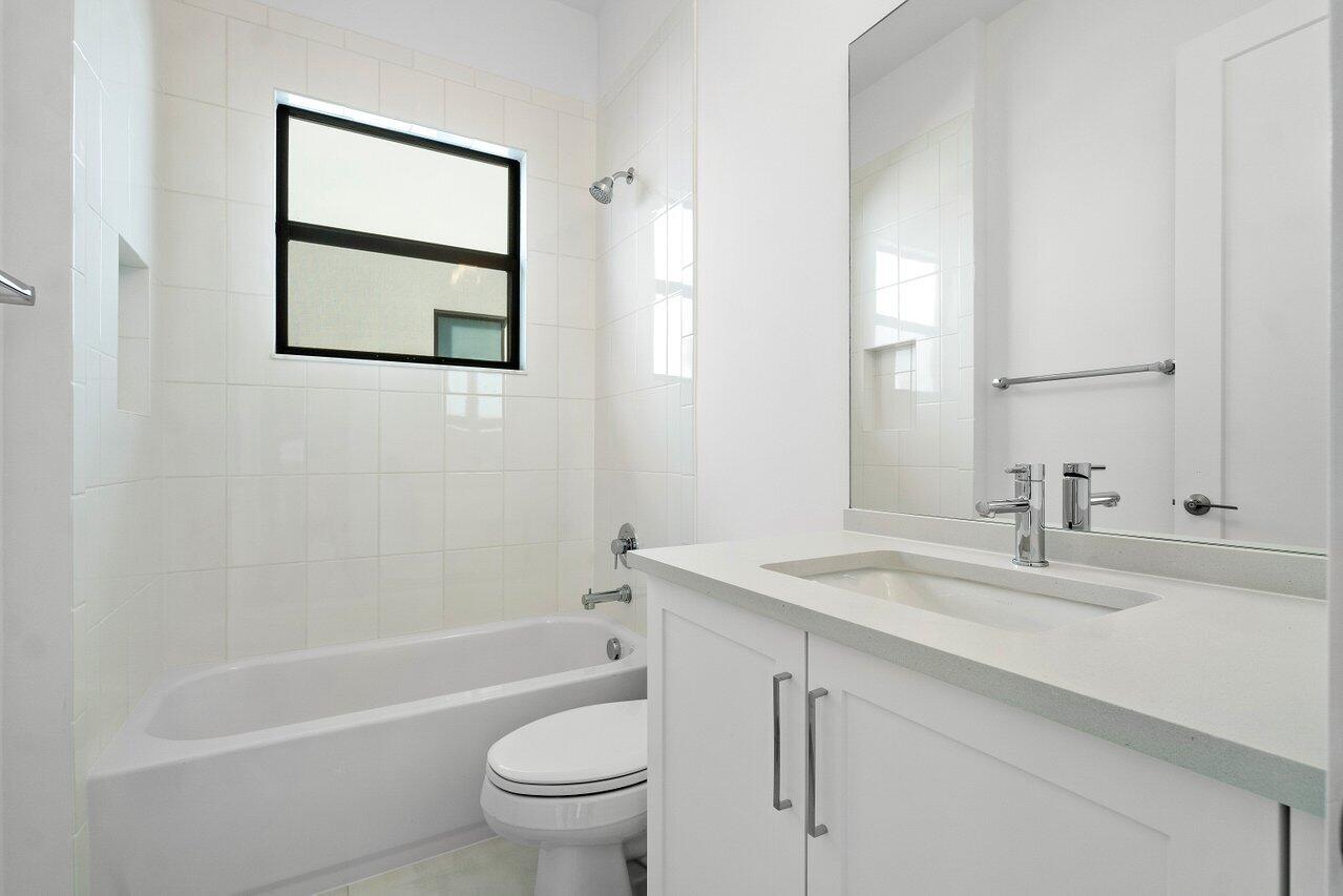 17291 Rainstream Road Boca Raton, FL 33496 - Photo 17 of 21 a bathroom with a sink toilet and a bathtub