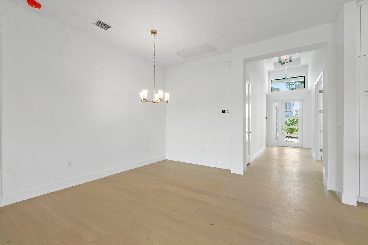 17291 Rainstream Road Boca Raton, FL 33496 - Photo 3 of 21 a view of empty room with wooden floor