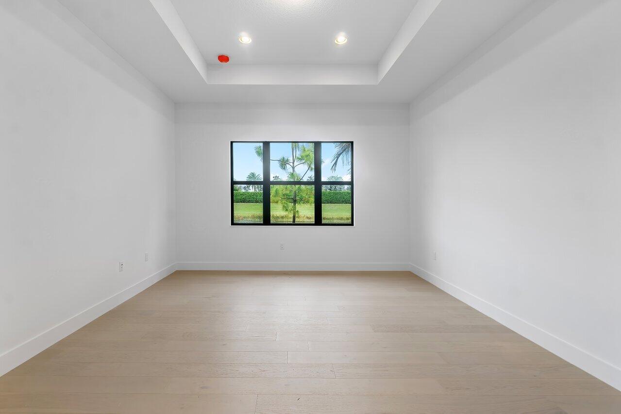 17291 Rainstream Road Boca Raton, FL 33496 - Photo 9 of 21 an empty room with windows