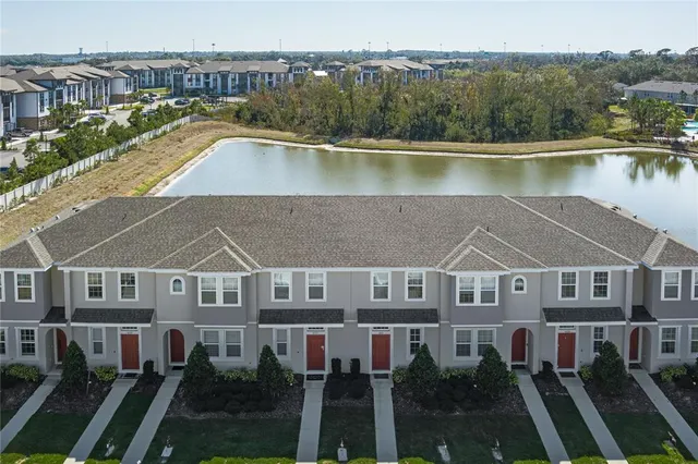an aerial view of a house with a lake view